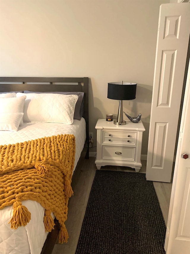 bedroom featuring dark wood-type flooring