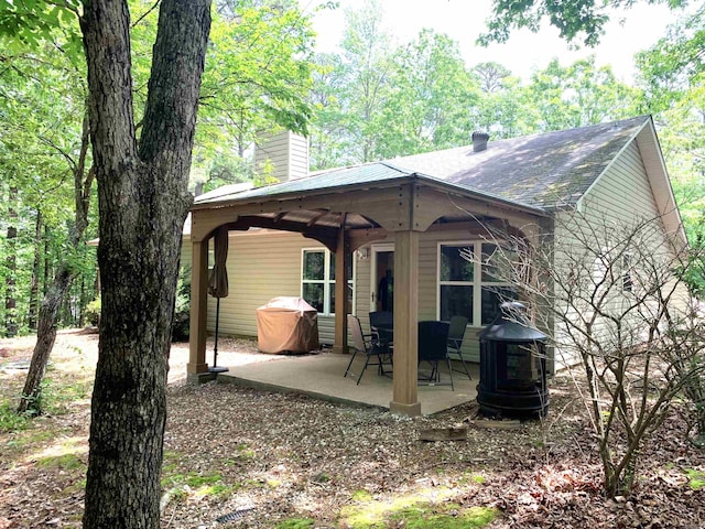 rear view of property with a patio area