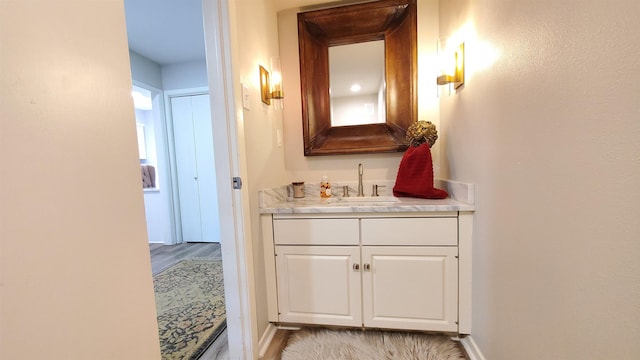 bathroom featuring vanity and hardwood / wood-style flooring