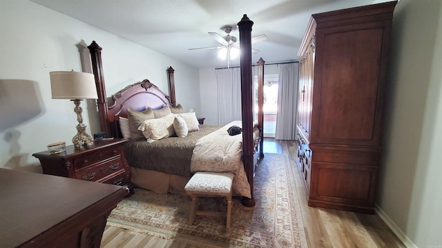 bedroom with light hardwood / wood-style floors and ceiling fan