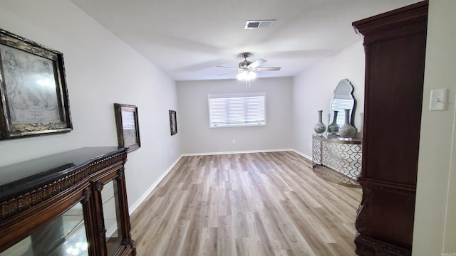 unfurnished living room with light hardwood / wood-style floors and ceiling fan