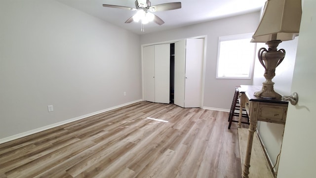 bedroom with a closet, ceiling fan, and light wood-type flooring