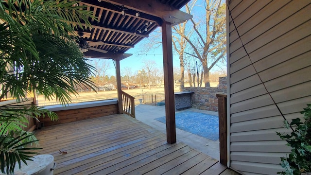 wooden terrace featuring a patio and a pergola