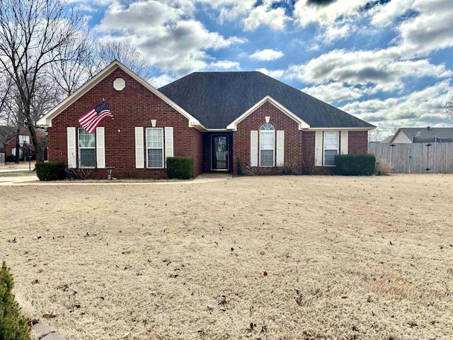 ranch-style home with a front yard