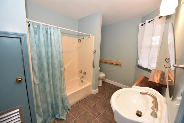 full bathroom with sink, shower / tub combo with curtain, tile patterned floors, and toilet