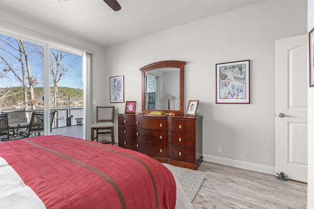 bedroom featuring ceiling fan, light hardwood / wood-style floors, and access to outside