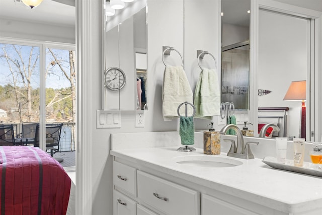 bathroom with plenty of natural light and vanity