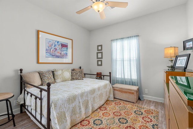 bedroom with ceiling fan and light wood-type flooring