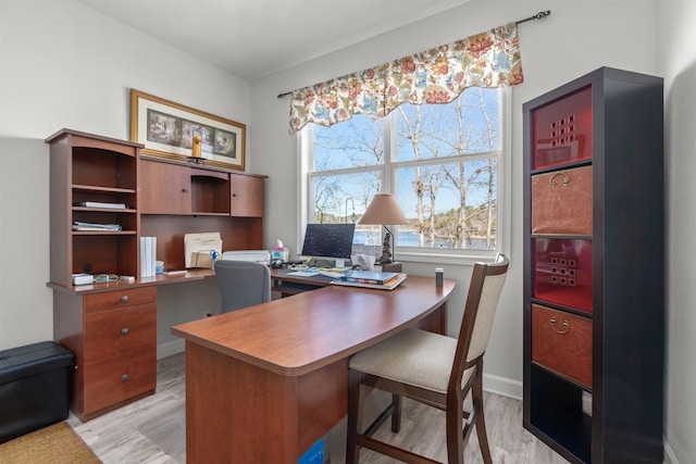 home office with light wood-type flooring