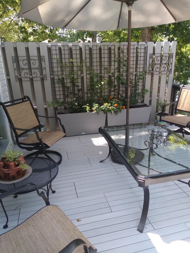 wooden balcony featuring a deck