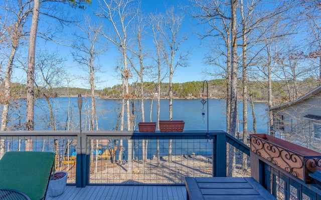 wooden deck with a water view