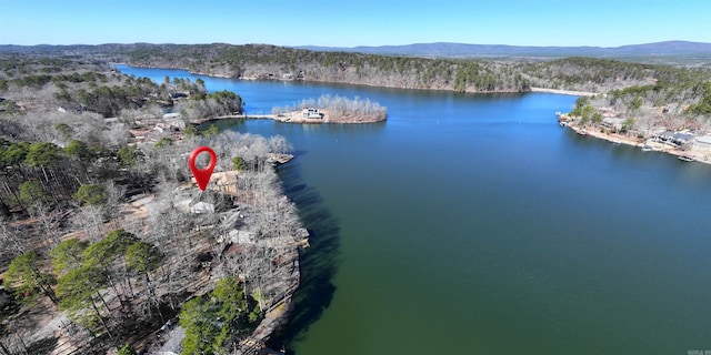 aerial view featuring a water and mountain view