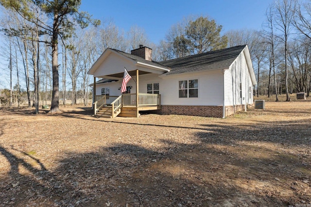 view of front of house featuring a porch and central AC unit