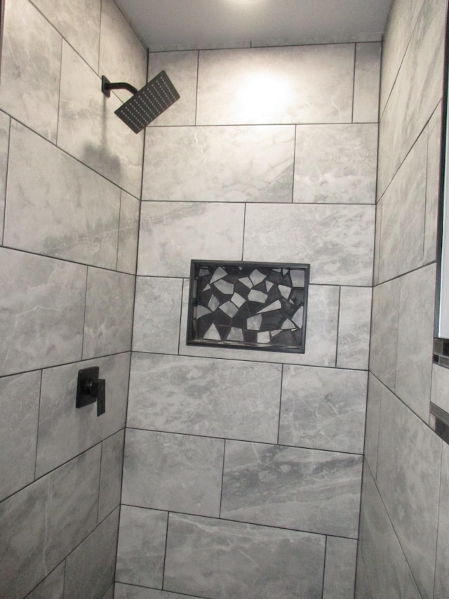 details featuring a tile shower