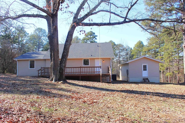 back of house with a wooden deck