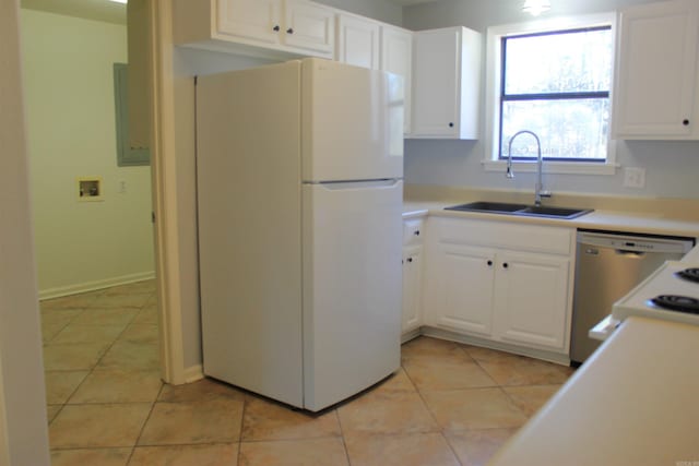 kitchen featuring sink, stainless steel dishwasher, white cabinets, and white fridge