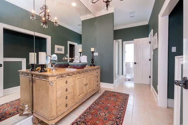 bathroom featuring tile patterned flooring, ornamental molding, vanity, and walk in shower