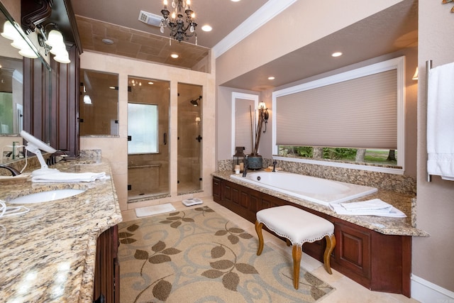 bathroom featuring vanity, a notable chandelier, and separate shower and tub