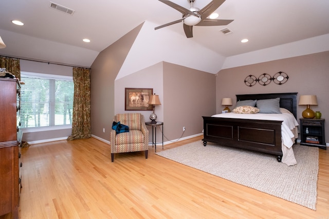 bedroom featuring lofted ceiling, ceiling fan, and light wood-type flooring