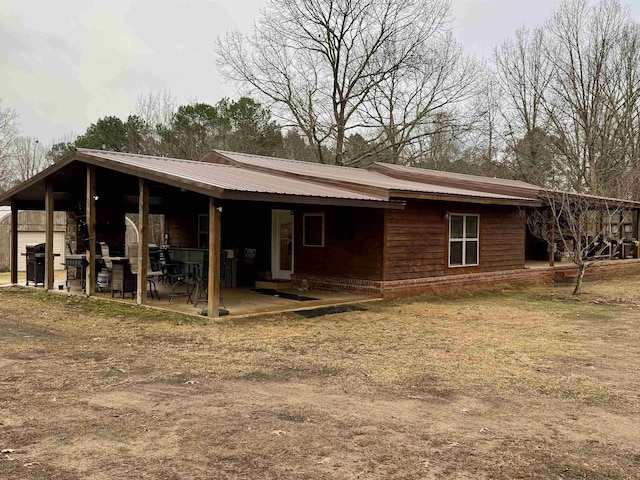 rear view of property with a patio