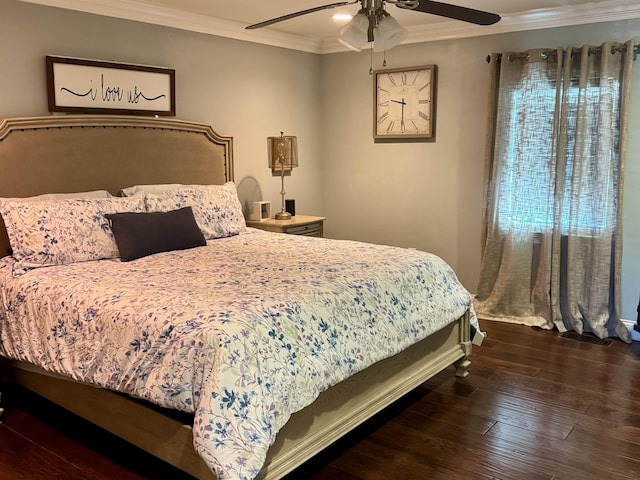 bedroom featuring crown molding, dark hardwood / wood-style floors, and ceiling fan