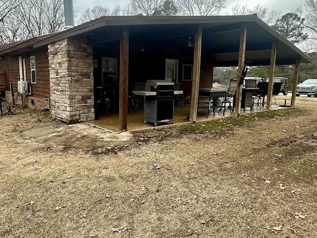 view of patio with a grill