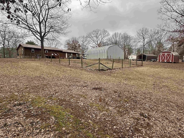 view of yard with a storage unit