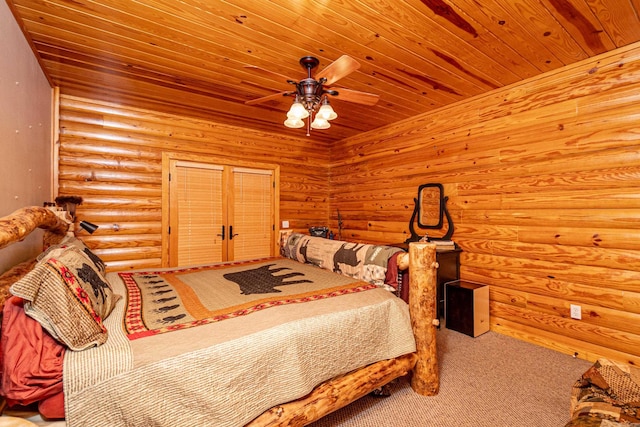 bedroom with wooden ceiling, carpet flooring, rustic walls, and ceiling fan