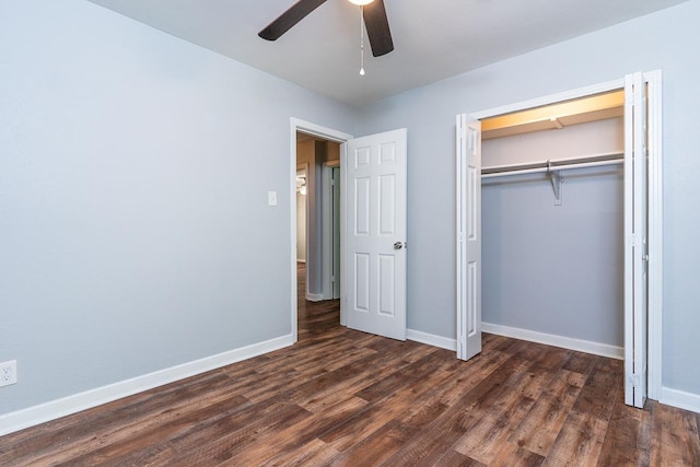 unfurnished bedroom featuring dark hardwood / wood-style flooring, a closet, and ceiling fan