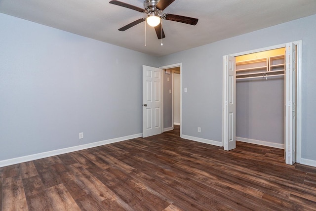 unfurnished bedroom featuring dark wood-type flooring, a closet, and ceiling fan