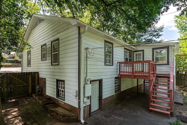 view of home's exterior featuring a deck