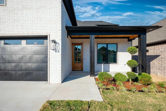 doorway to property featuring a garage