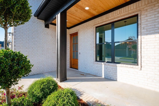 entrance to property featuring a patio area