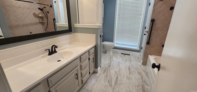 full bathroom with vanity, toilet, and tiled shower / bath combo