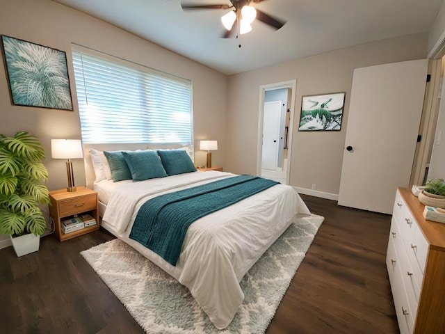 bedroom with ceiling fan and dark hardwood / wood-style floors