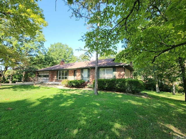 ranch-style house with a front yard