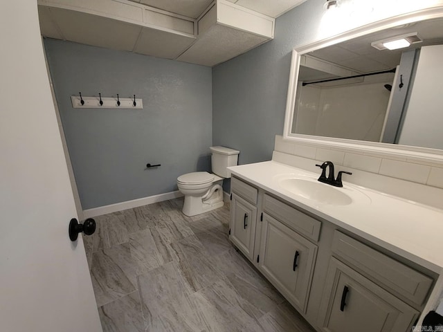 bathroom with vanity, toilet, and walk in shower