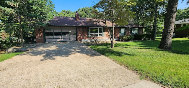 ranch-style home with a garage and a front lawn