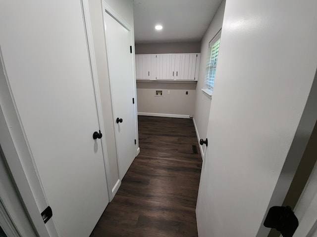 clothes washing area with cabinets, dark hardwood / wood-style floors, hookup for a washing machine, and electric dryer hookup