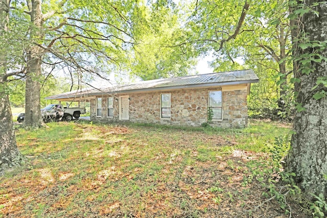 back of house with a carport