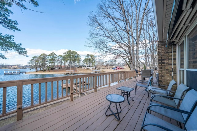 wooden deck featuring a water view