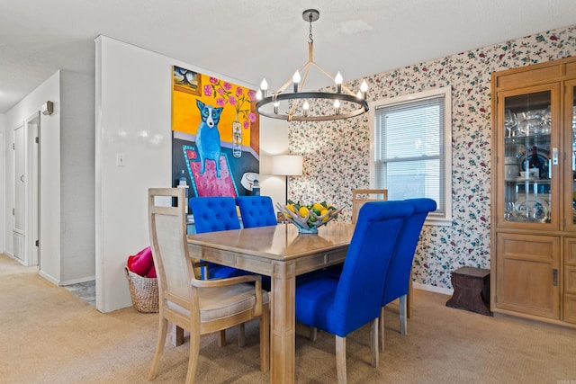 carpeted dining area with a chandelier