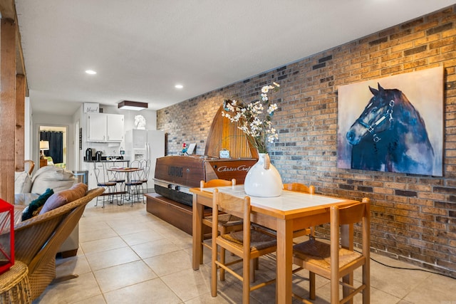 tiled dining space with brick wall