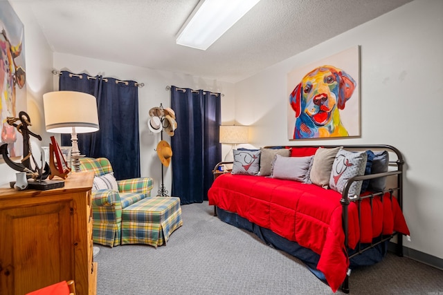 bedroom featuring a textured ceiling and carpet flooring