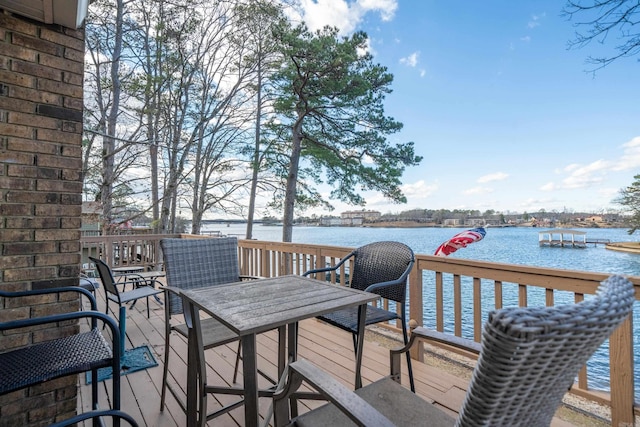 wooden terrace with a water view