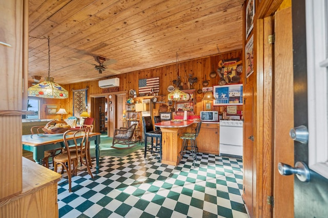 dining area with a wall mounted air conditioner, wooden ceiling, ceiling fan, and wood walls