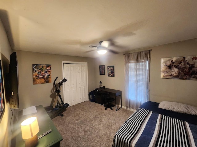 carpeted bedroom featuring ceiling fan and a closet