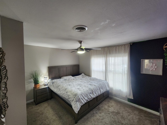 bedroom featuring carpet floors, baseboards, visible vents, and ceiling fan