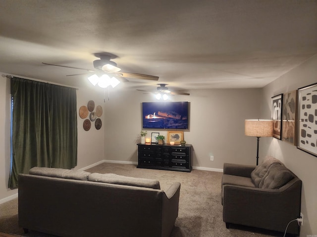 living area with carpet floors, ceiling fan, and baseboards