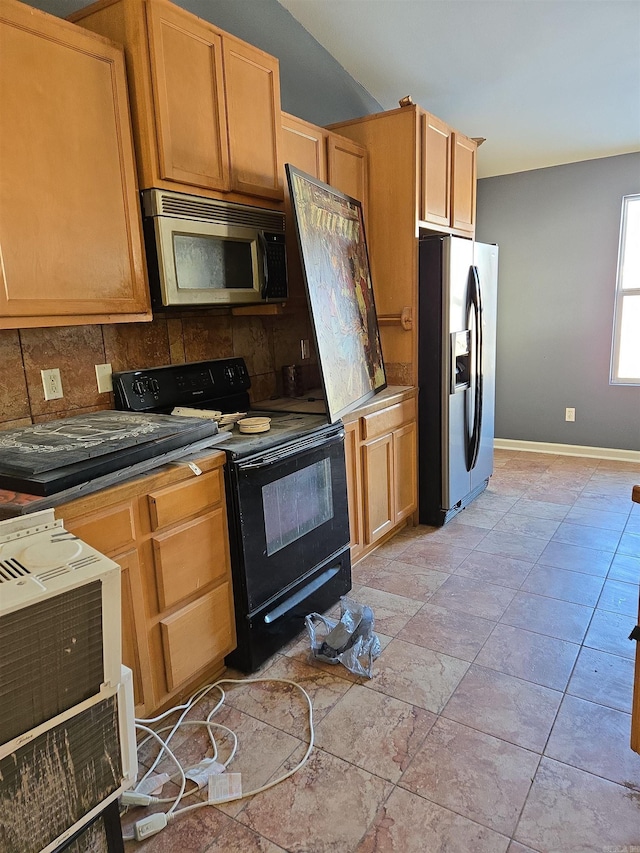 kitchen with light tile patterned floors, decorative backsplash, and stainless steel appliances